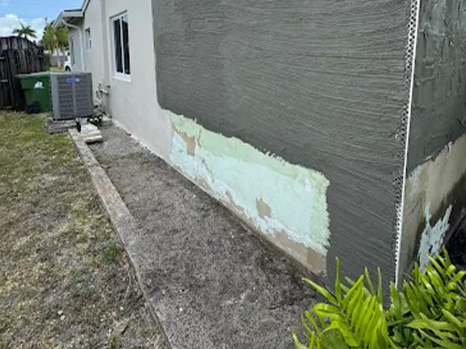 Stucco wall repair patching shutter holes on a home in Boca Raton